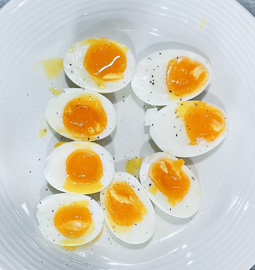 4 Eggs cut diagonally in half. Seasoned with salt and pepper.