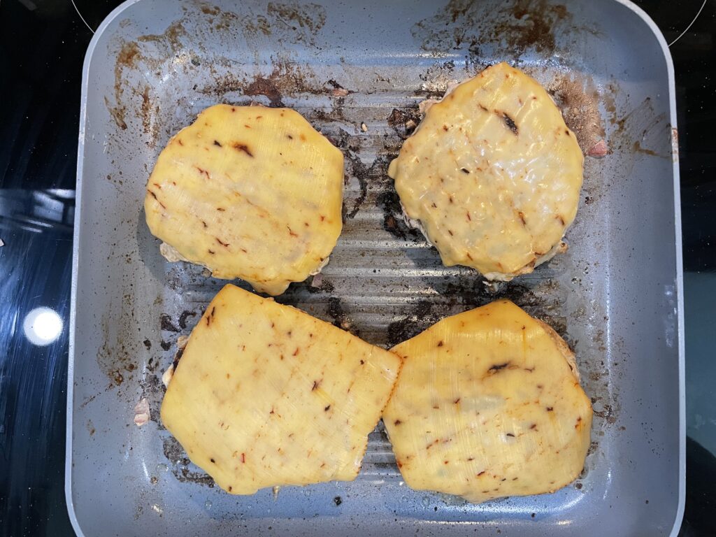 Place cheese on top of burger after burger meat temp reached 165.