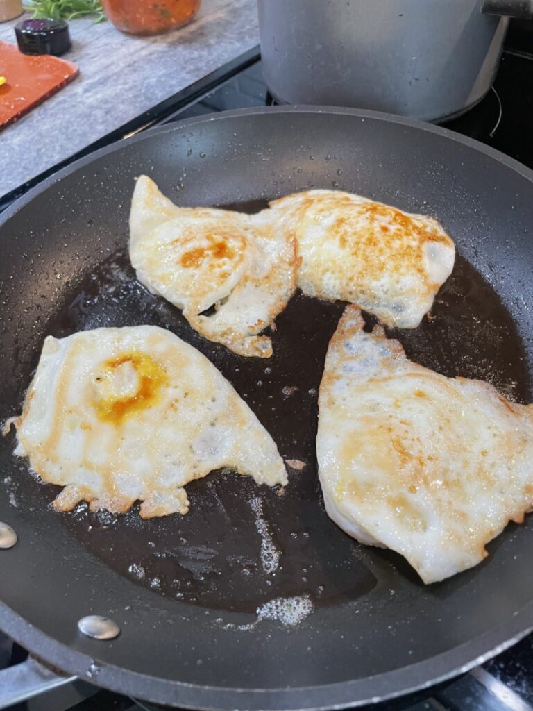 4 Over easy eggs on a 12 inch pan. 
